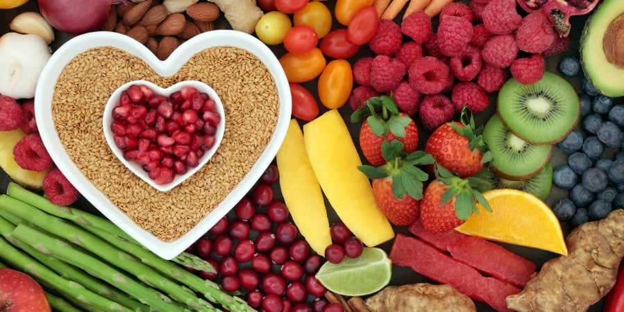 fruits-and-vegetables-with-heart-shaped-bowls-frilled-with-grains-and-fruits