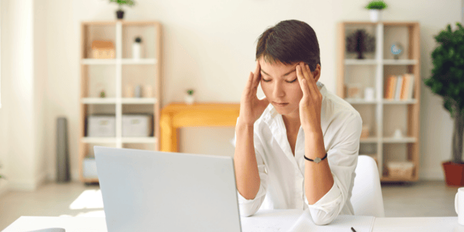 woman-with-migraine-holding-the-sides-of-her-head