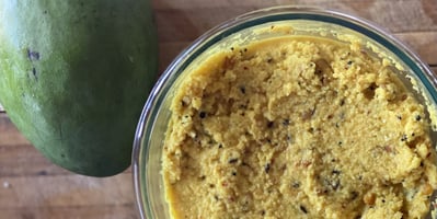 Raw mangoes, or green mangoes, are unripened fruit that are firm to the touch, with whitish-colored flesh. This ensures that the fruit is still sour.