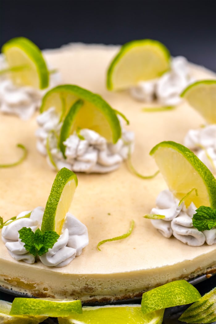Organic Plant-Based Keylime Pie with vegan whipped cream and fresh limes