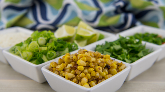 roasted-corn-and-fresh-cilantro-limes-and-green-onion-toppings-for-quinoa-salad