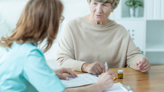 Doctor and Elderly Woman Discussing Healthcare Access to Plans