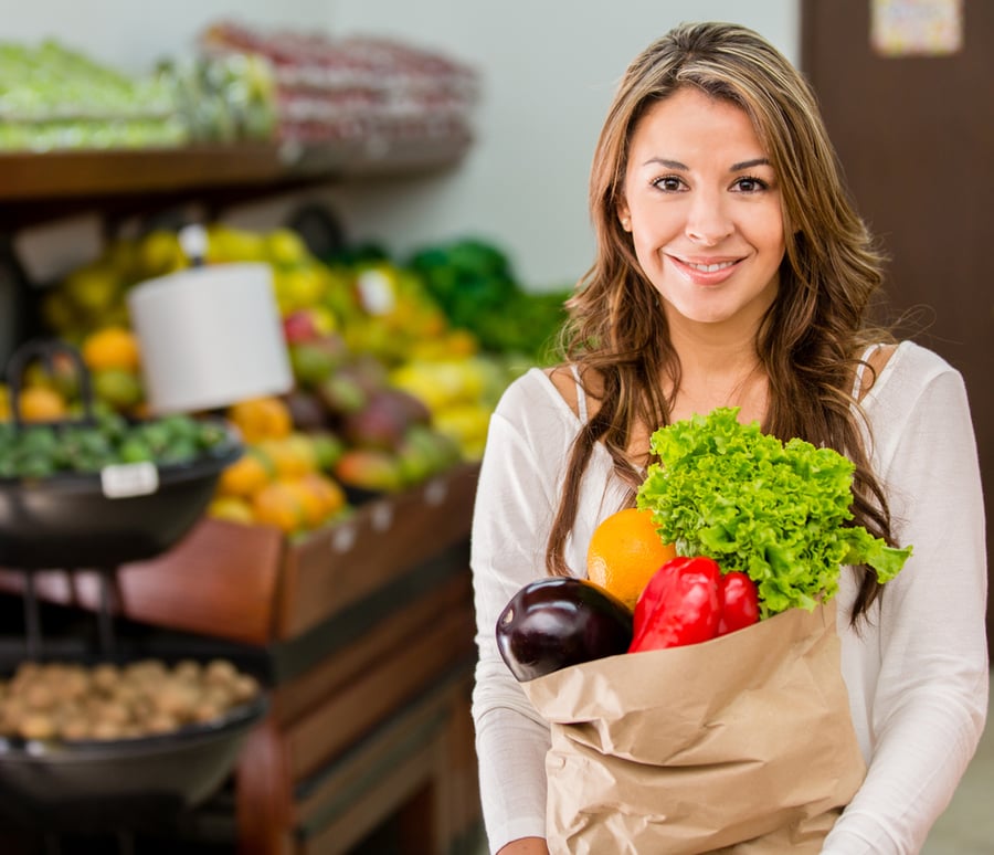 Happy Woman grocery shopping local market plant-based vegan foods