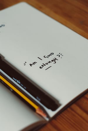 Am I good enough? written in notebook