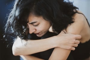 Woman processing traumatic pain and healing with help and eating plant-based diet